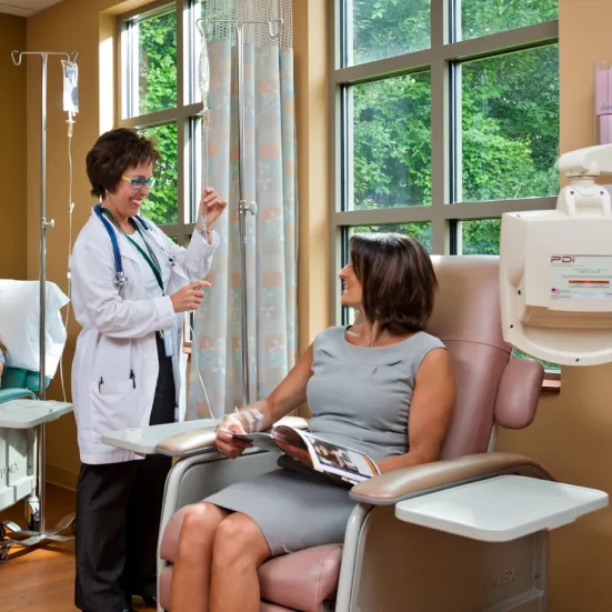 Doctor smiling while talking to a patient